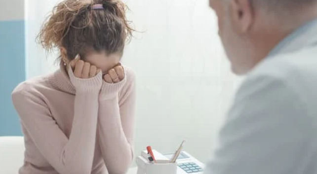 an upset woman at a doctor's office